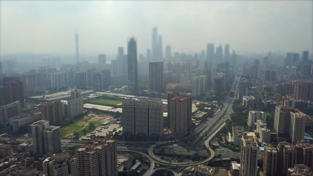 guangzhou cityscape sunny day traffic road junction aerial panorama tilt-shift 4k china