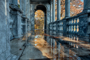 Tsarskoye Selo, St Petersburg, Russia - Marble Bridge with puddles and fallen leaves in Catherine...