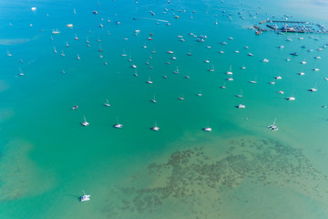 Aerial view drone shot of sailing boats in tropical sea.