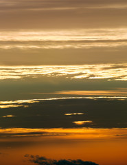 Fantastic clouds at sunrise, vertical panorama
