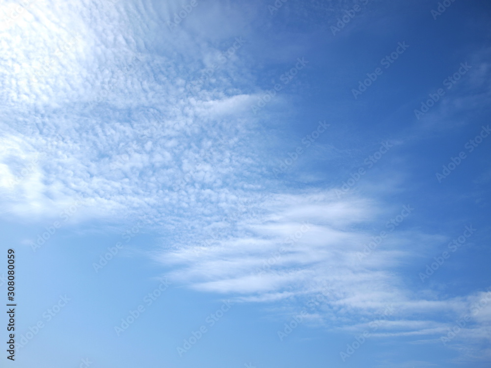 Wall mural beautiful thin white clouds on a blue sky background