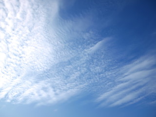 Beautiful thin white clouds on a blue sky background