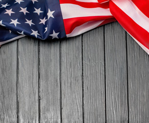  US flag on wooden background.