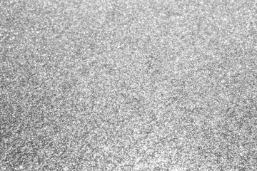 Abstract silver glitter sparkle defocused light background