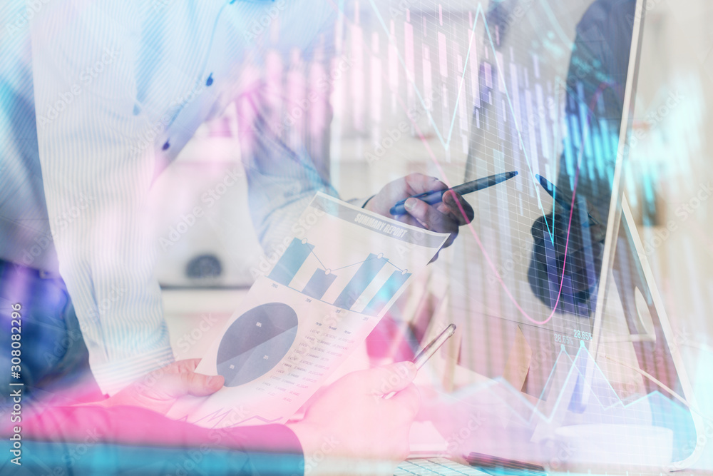 Poster double exposure of chart with businessman typing on computer in office on background. concept of har