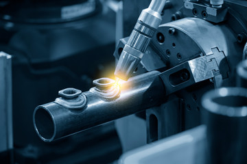 The abstract scene of robotic arm welding machine . The hi technology automotive parts...