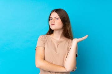 Ukrainian teenager girl over isolated blue background unhappy for not understand something