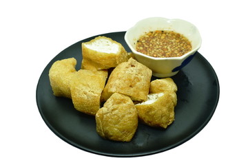 deep fried tofu dipping with sweet crushed bean sauce on plate