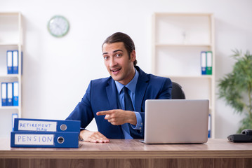 Young male accountant working in the office