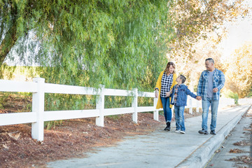 Mixed Race Family Taking A Walk Outdoors