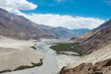 Ladakh, India - Jul 24 2019 - Beautiful scenic view from Between Diskit and Khardung La Pass (5359m) in Nubra Valley, Ladakh, Jammu and Kashmir, India.