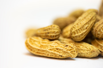 Shooting a bunch of peanuts on a white background