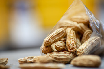 Closeup view of steamed golden groundnuts. Groundnut is scientifically known as Arachis hypogaea.Nuts mix in a plastic bag in table