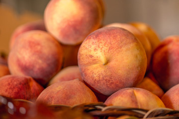 Close up image of fresh peaches stacked together