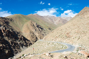 Ladakh, India - Aug 03 2019 - Riders on Between Khardung La Pass (5359m) and Leh in Ladakh, Jammu and Kashmir, India.
