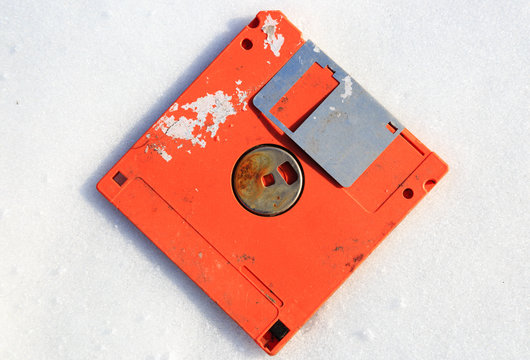 abandoned broken floppy disk display in white background view
