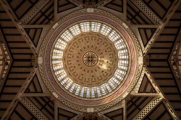 Interior view of the dome of the central market of Valencia in beautiful light, Spain