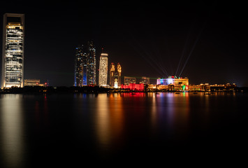 Fototapeta premium Abu Dhabi city famous towers and skyscrapers at night - Landmarks and tourist attractions