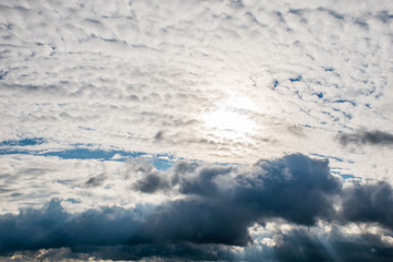 the sun's rays shine through the clouds. cloudy sky, background