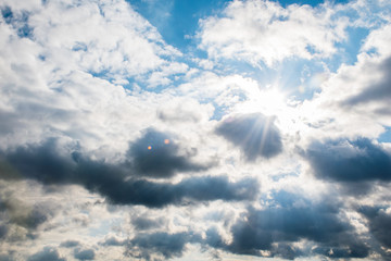 the sun's rays shine through the clouds. cloudy sky, background