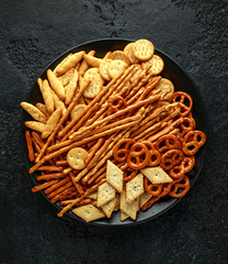 Pretzel cracker mix lightly salted with sesame and poppy seeds, Christmas party treat snacks