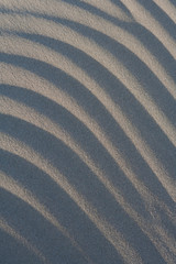 Sand waves on a beach.