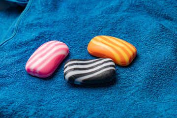 three pieces of striped soap bars on the towel textile texture, spa and bathroom using