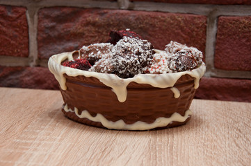 Homemade candy in chocolate basket. chocolate art figure. sweet life. holiday celebration. candy shop. sprinkles and topping. cook at home. chocolate workshop. homemade chocolate