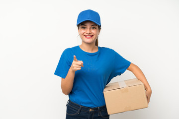 Young delivery girl over isolated white background points finger at you