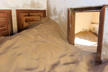 Abandoned and forgotten building and room left by people and being taken over by encroaching...