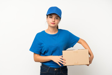 Young delivery girl over isolated white background keeping arms crossed