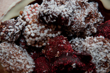 sprinkles and topping. cook at home. chocolate workshop. homemade chocolate. Homemade candy in chocolate basket. chocolate art background. sweet life. holiday celebration. candy shop