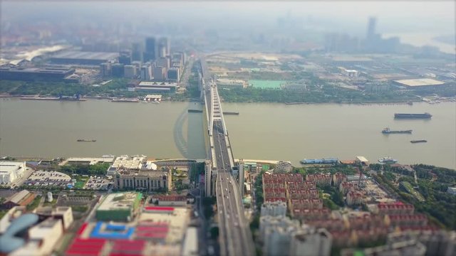 day time shanghai cityscape traffic lupu bridge riverside aerial panorama 4k tilt shift china