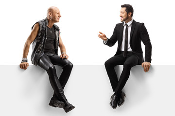 Punker and a businessman sitting on a panel and having a conversation