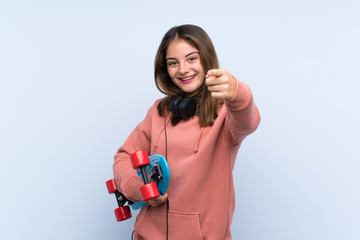 Young skater girl over isolated background