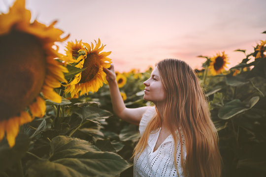 Woman In Sunflowers Field Harmony With Nature Travel Healthy Lifestyle Outdoor Agriculture Organic Harvest Ecology Concept