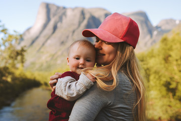 Mother and baby daughter family traveling together enjoying mountains view healthy lifestyle mom...