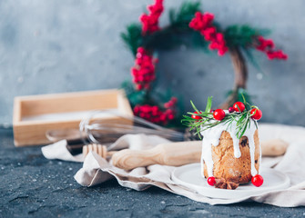 Christmas festive pound cake decorated with cranberries almonds and rosemary twigs