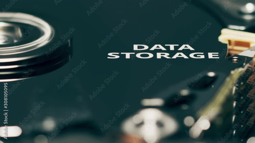 Poster head of computer hard disk drive reveals data storage text