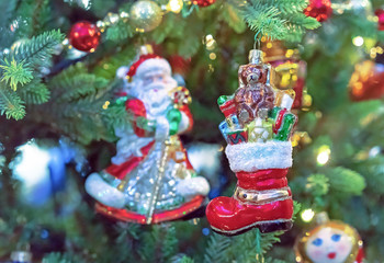 Glass Christmas tree toy - red boot Santa Claus's with gifts. Christmas decor in vintage style.