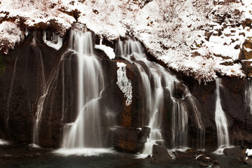 Hraunfossar is a series of waterfalls formed by rivulets streaming over a distance of about 900...