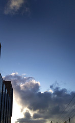 clouds above the city, above the wires