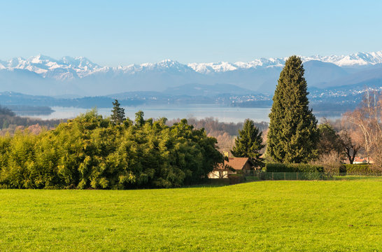 Landscape with view of Lake Varese and snow capped mountains from Azzate Belvedere, province of Varese, Italy