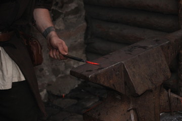 A Blacksmith Models A Bar Of Iron With Hammer After Took It From Fire Forge 