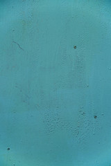 Painted metal wall with scratches and cracks