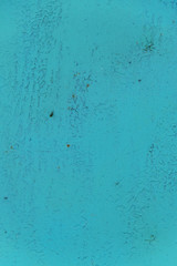 Painted metal wall with scratches and cracks