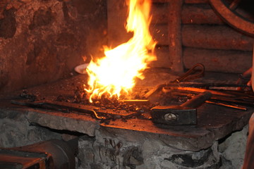 A Blacksmith Models A Bar Of Iron With Hammer After Took It From Fire Forge 