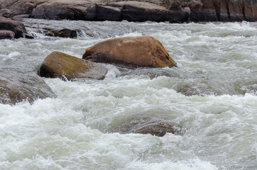 Rapid moving water at Pabineau Falls, New Brunswick, Canada
