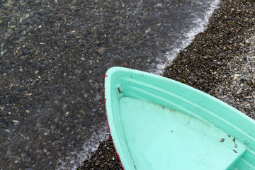 A fishing boat on a sea shore, sea on background, copy space