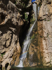 Fototapeta na wymiar The waterfall of Salto de los Órganos on the route of the Borosa River in the Natural Park of the Sierra de Cazorla, Segura and Las Villas. In Jaén, Andalusia. Spain